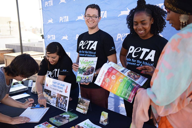 peta volunteers at table